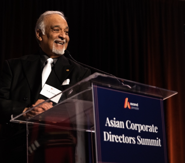 S. K. Gupta speaking at the Asian Corporate Directors Summit podium for Ascend Pinnacle